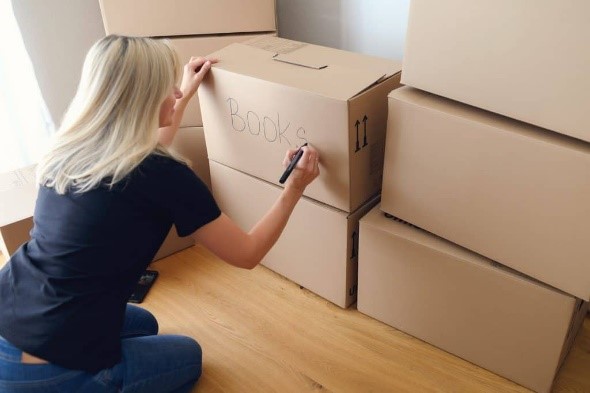 Lady writing in a box